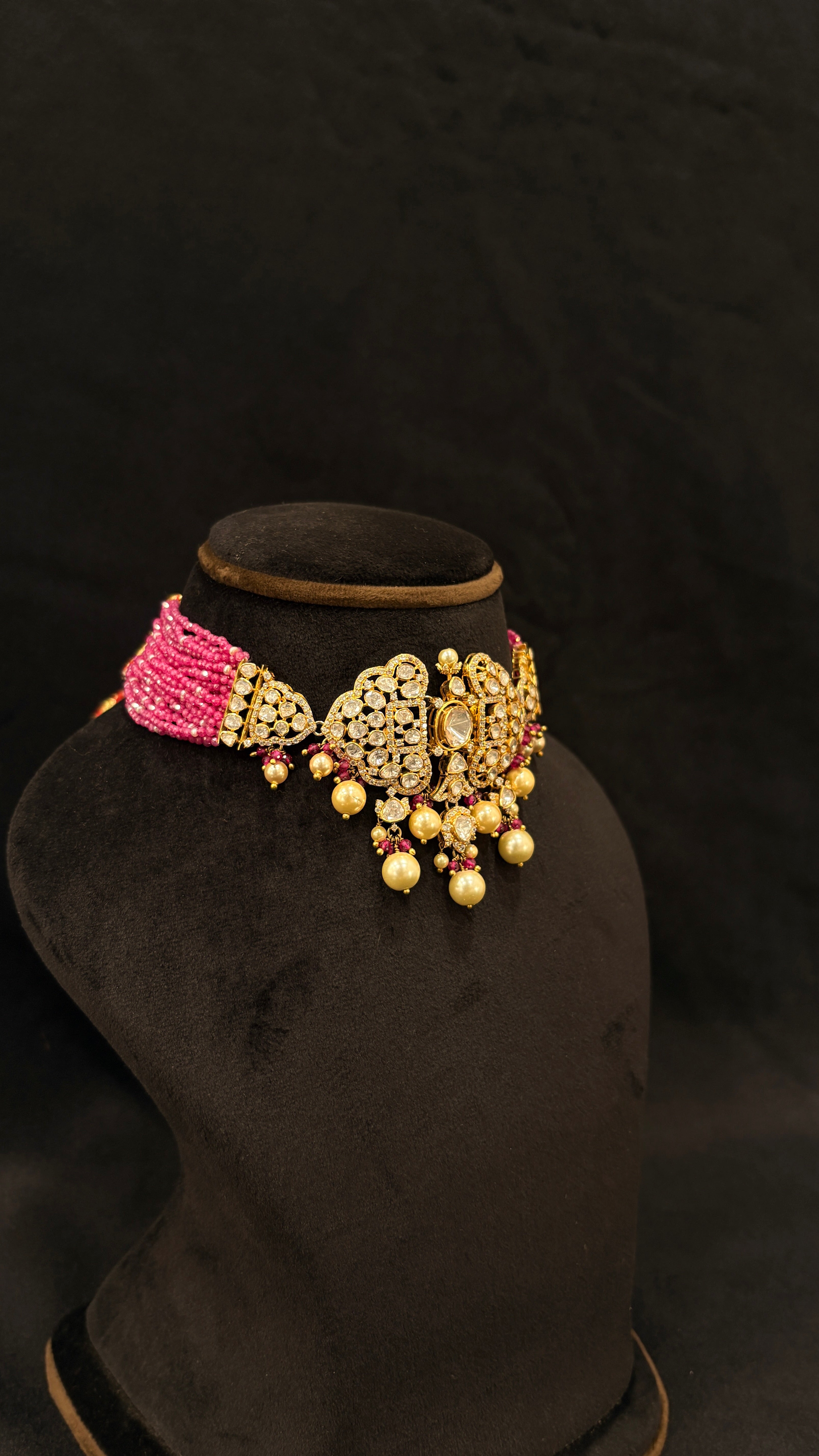 Sia Polki Gulabi Dil Choker – multi-strand pink seed bead choker with three open filigree heart polki medallions, ruby accents and golden pearl drops, handcrafted in Jodhpur