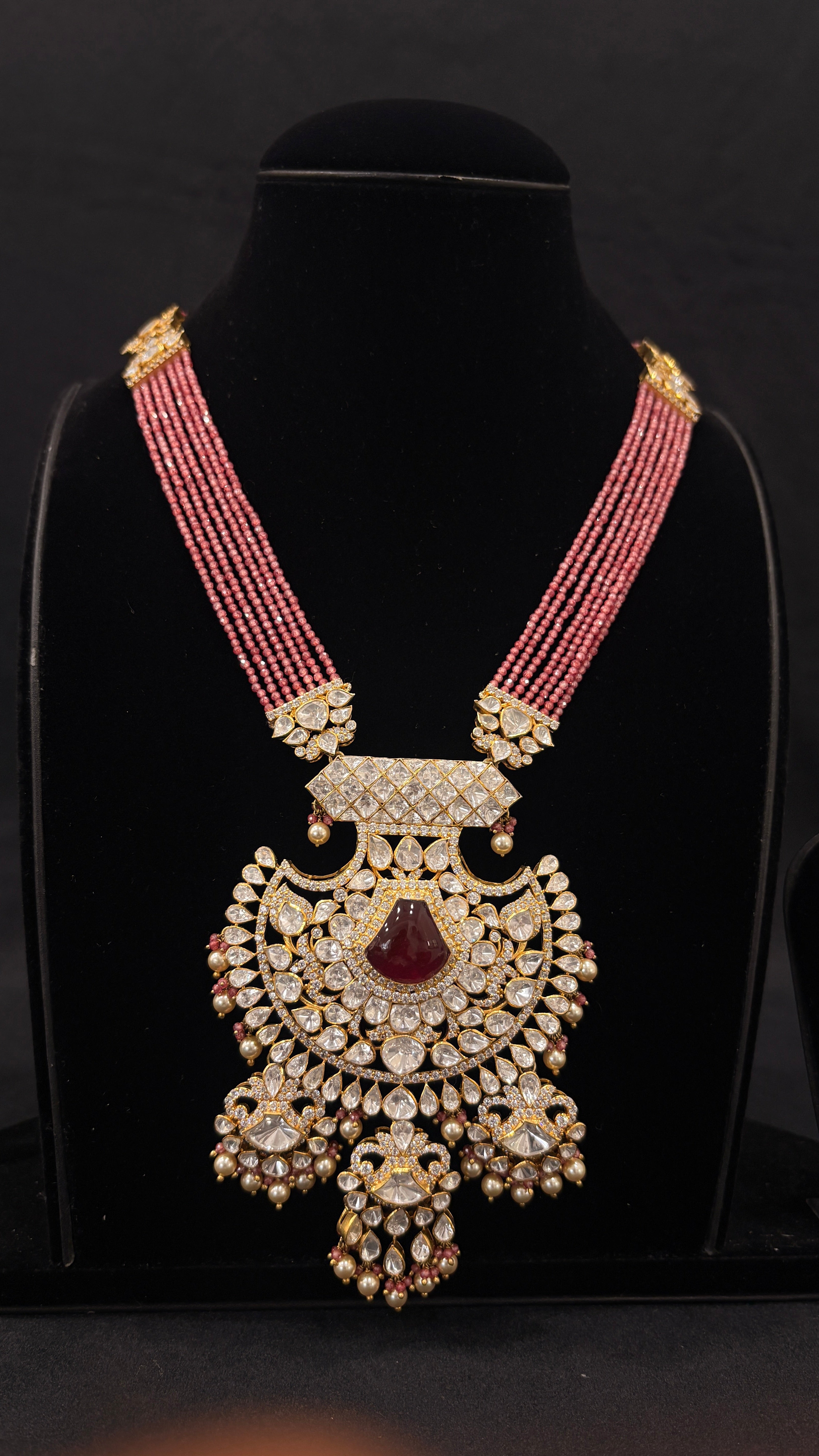 Sia Polki Laal Chaand Haar – multi-strand ruby pink seed bead polki long necklace with crescent fan pendant, ruby cabochon centre and fringe drops, handcrafted in Jodhpur