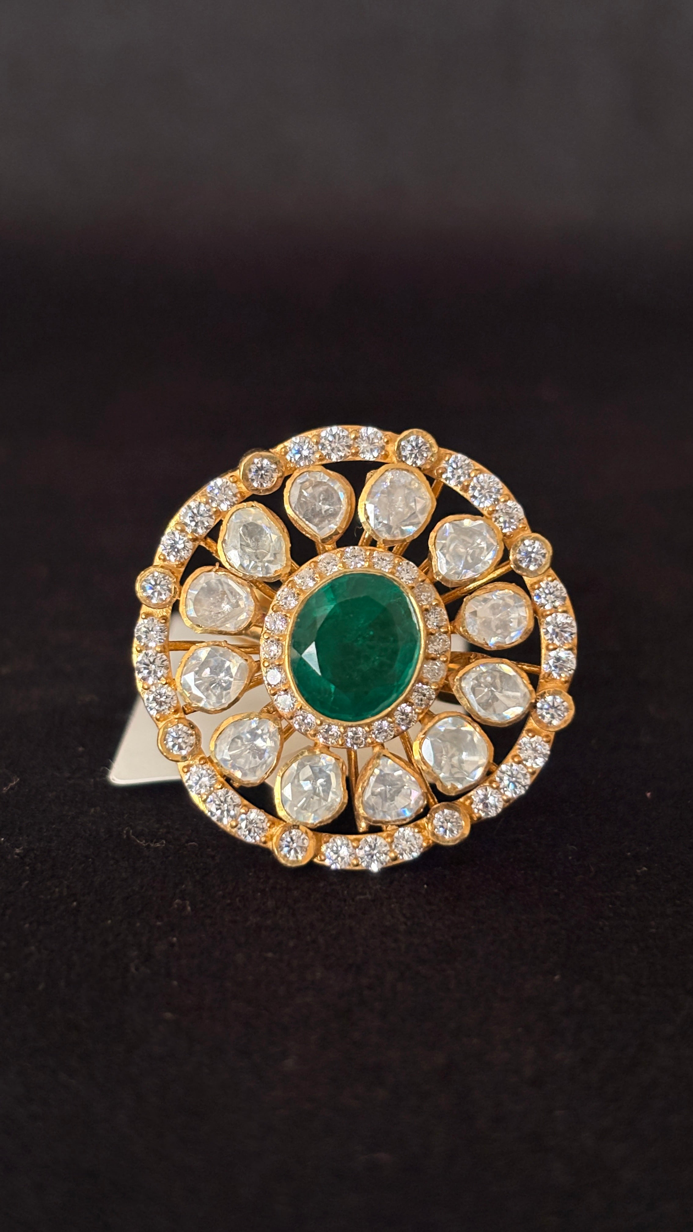 Sia Polki Panna Chakra Ring – open disc cocktail ring with oval emerald centre, eight moissanite polki spokes and AD outer circular border, adjustable band, handcrafted in Jodhpur