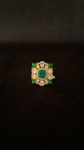Sia Polki Panna Meena Ring – cushion cocktail ring with oval emerald centre, moissanite polki halo and green meenakari enamel leaf corners, adjustable band, handcrafted in Jodhpur