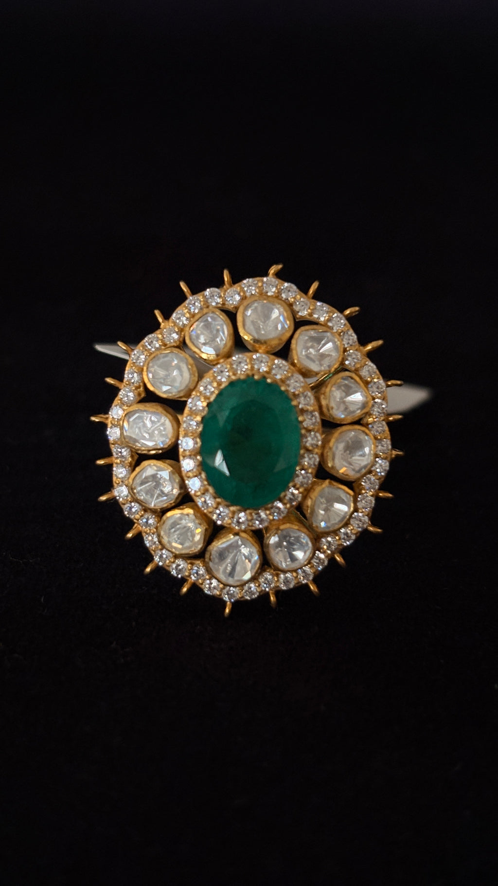 Sia Polki Panna Suraj Ring – oval emerald centre cocktail ring with ten moissanite polki and spiked gold sunburst AD border, adjustable band, handcrafted in Jodhpur