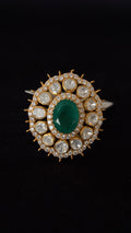 Sia Polki Panna Suraj Ring – oval emerald centre cocktail ring with ten moissanite polki and spiked gold sunburst AD border, adjustable band, handcrafted in Jodhpur