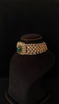 Sia Polki Panna Laal Choker – extra-wide bridal choker with dense moissanite polki, diagonal ruby red AD grid and large raw emerald cabochon centre, handcrafted in Jodhpur