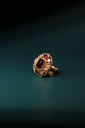 Sia Polki Laal Taj Ring – oval crown cocktail ring with deep burgundy rectangular centre, four teardrop moissanite polki and ruby accents in open filigree frame, handcrafted in Jodhpur