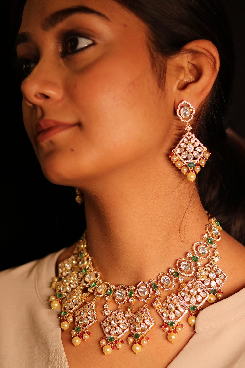 Sia Polki Panna Haar – gold-plated polki choker with emerald green stones, ruby accents and pearl drops, worn by bride, handcrafted in Jodhpur